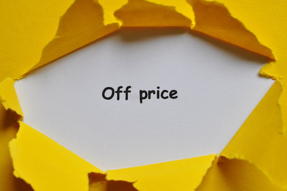 A white paper note with the words 'Off price' written in black ink is visible, partially torn through bright yellow torn paper with irregular edges, revealing the note underneath. The torn yellow paper is layered, creating a textured, rough surface around the central message. The background appears to be a solid yellow surface matching the torn paper, and the lighting is even, highlighting the contrast between the torn edges and the smooth, clean note inside. This scene may relate to discount or reduced-cost waste disposal services, presented in a professional, straightforward manner without promotional language, aligning with the context of alternative rubbish removal options provided by Waste Disposal Pimlico.